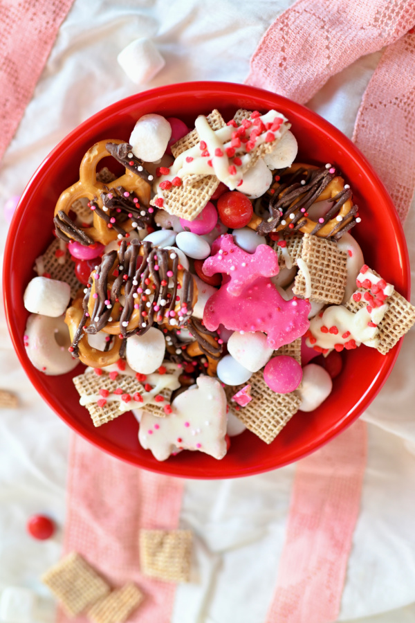 Valentine Chex Mix in a red bowl. 