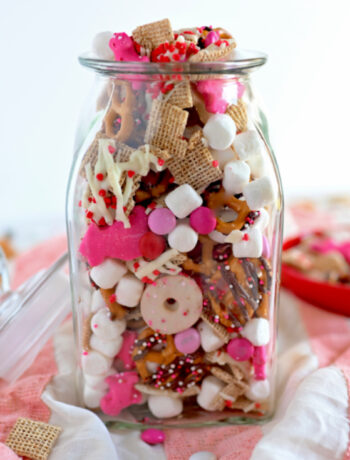 Valentine Chex Mix in a clear jar.