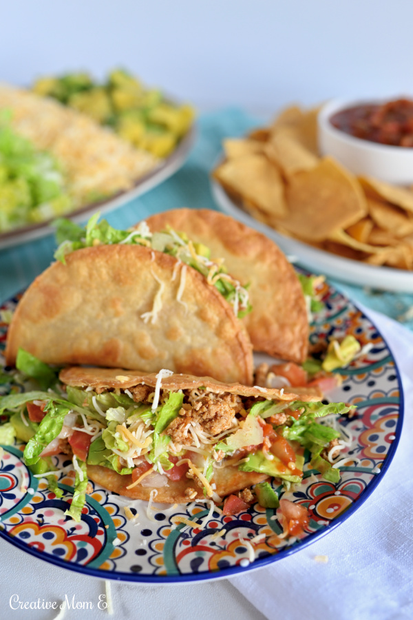Healthy ground turkey tacos on a fiesta plate.