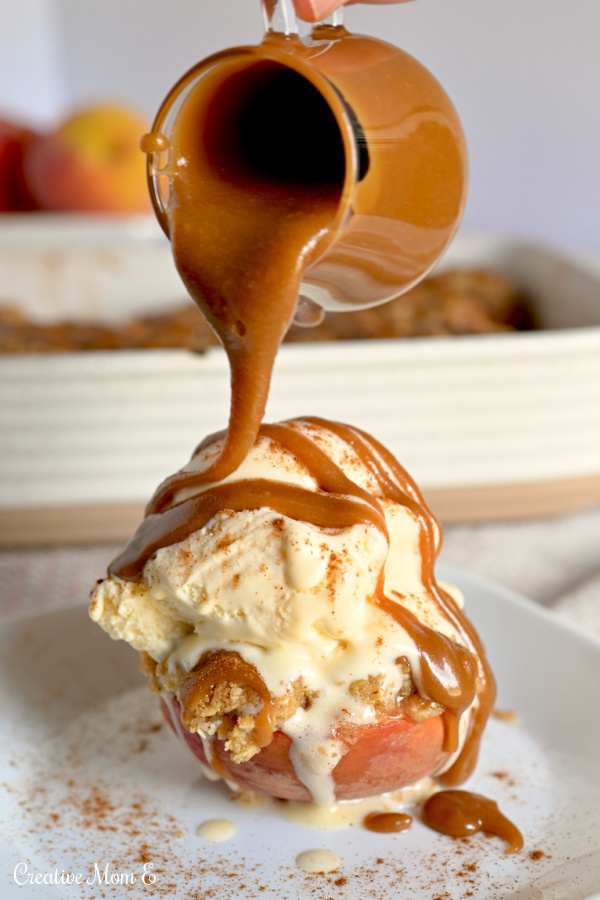 Caramel sauce sizzling over a juicy baked peaches with crumble topping.