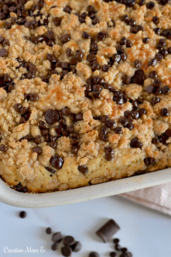 Oven baked pancake casserole covered in chocolate chips in a baking dish.