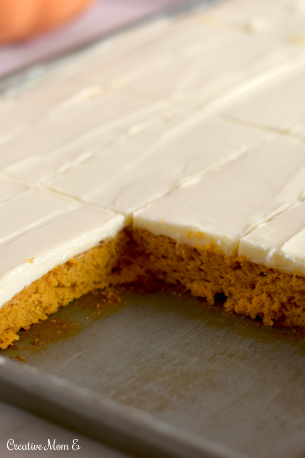 Cookie sheet filled with frosted pumpkin bars. 